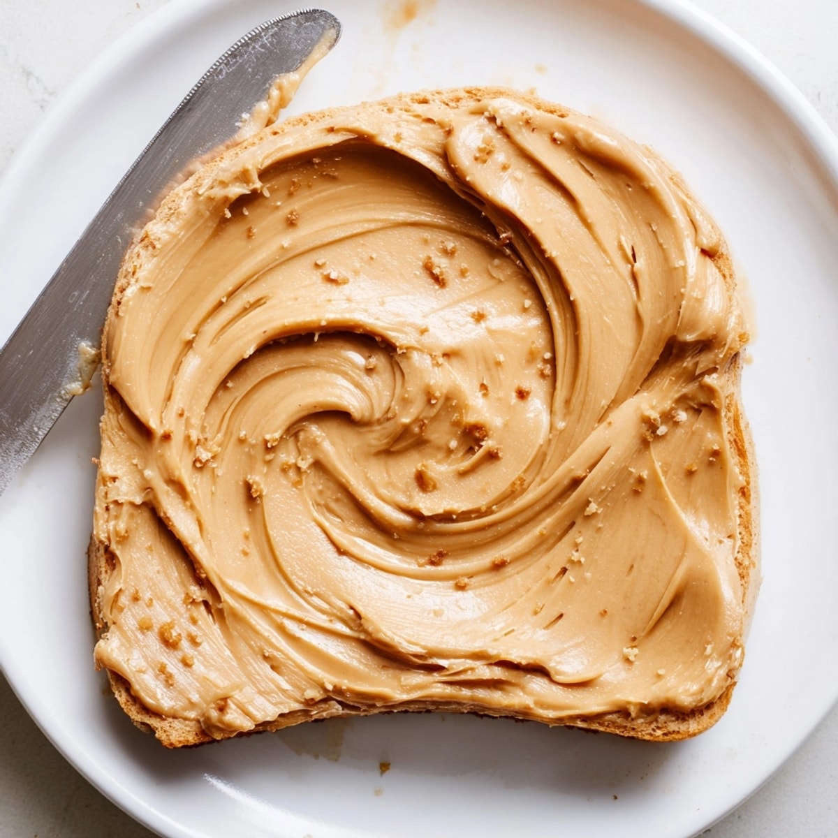 Golden Vegan Peanut Butter: A smooth and nutty spread, spread thick on whole-wheat toast.