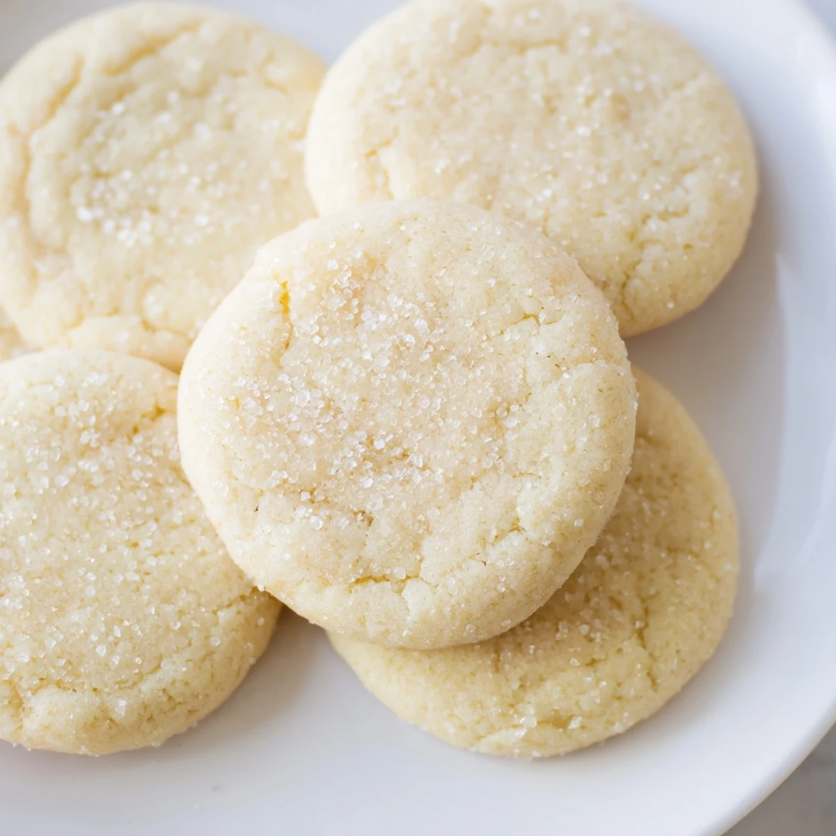 Fireplace Treat Vanilla Cloud Sugar Cookies, golden-brown and lightly sugared, ready to enjoy with hot cocoa.