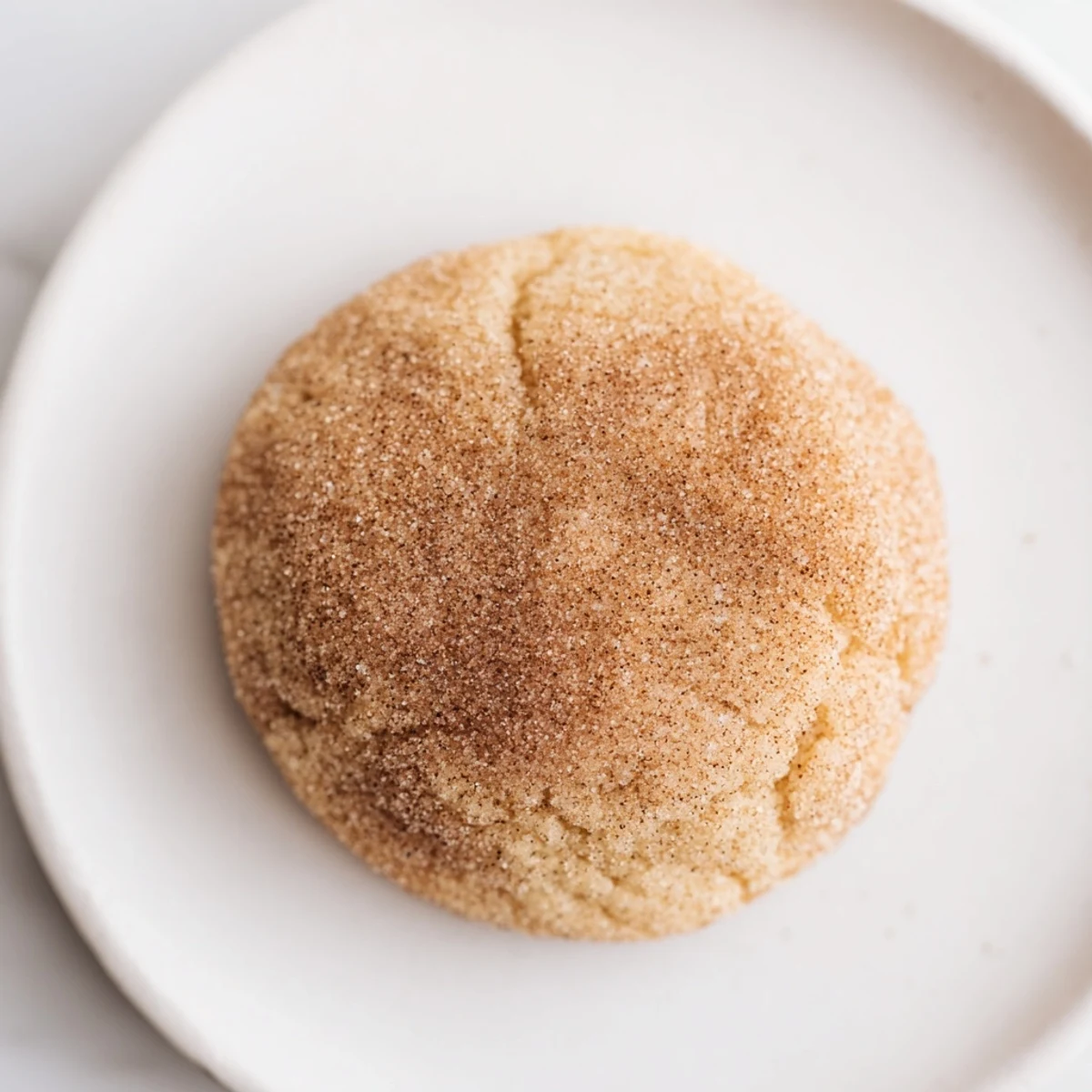 A close-up of buttery, aromatic January Bliss Cinnamon Drift Sugar Cookies fresh from the oven.