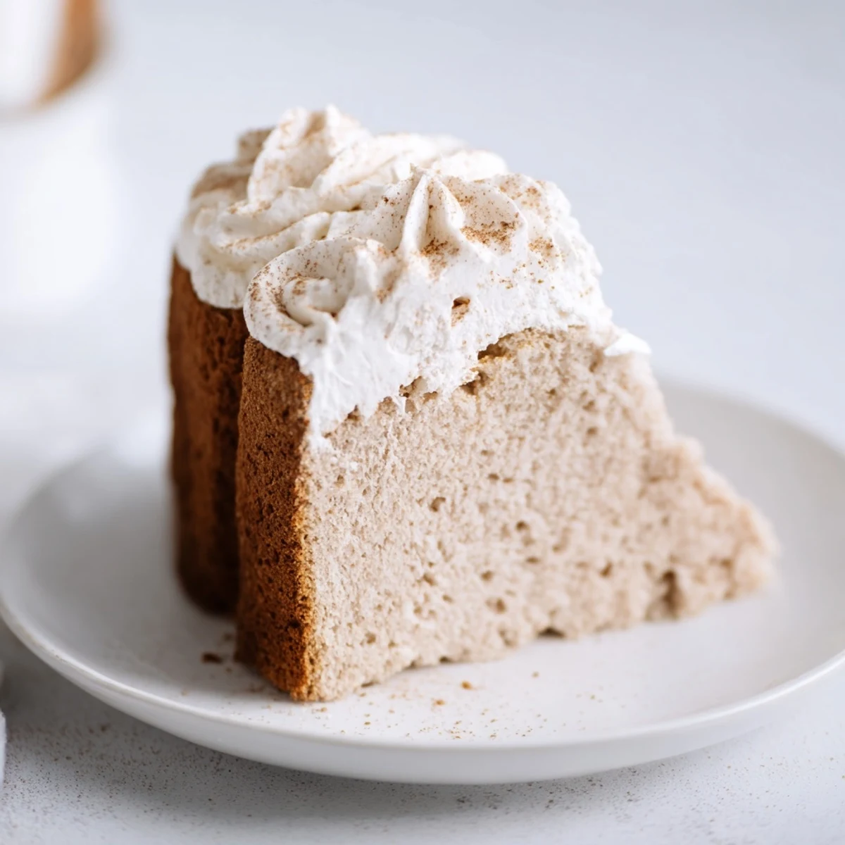 Fluffy Winter Spice Vanilla Cloud with a delicate dusting of cinnamon, perfect for dessert.