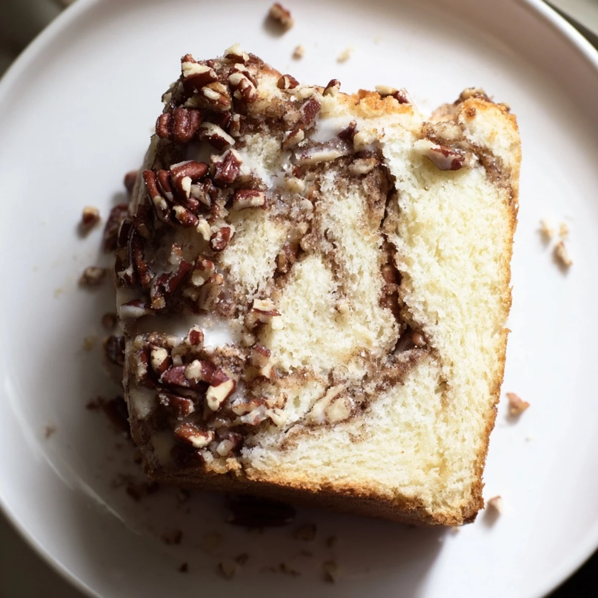 Warm, inviting image: A slice of Holiday Glow Cinnamon Drift reveals swirls of cinnamon.