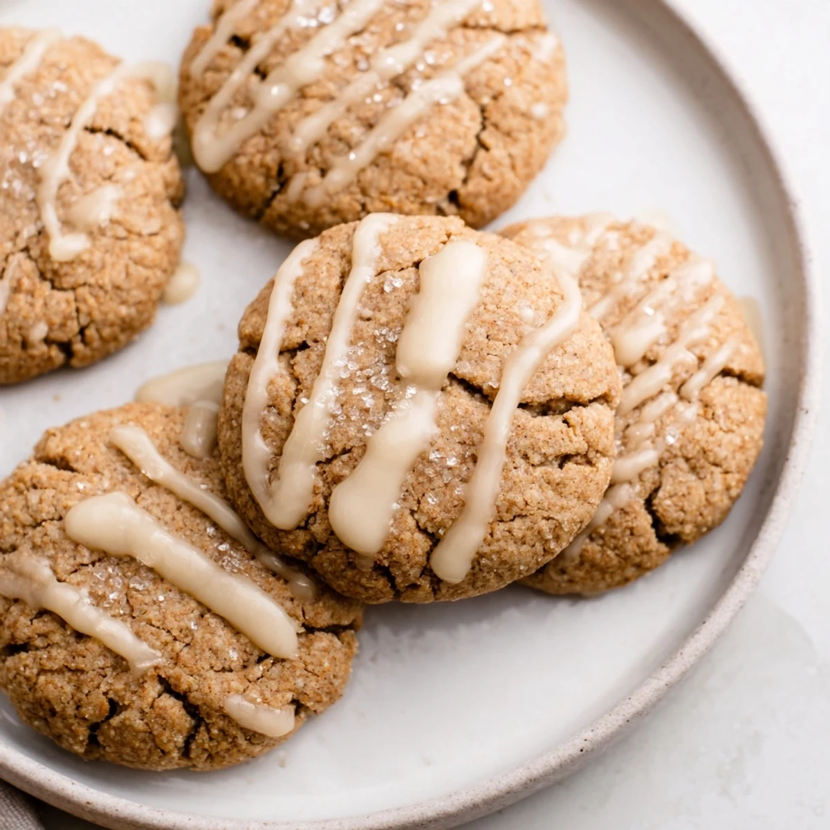 A close-up of delicious frosted delight ginger spice vegan cookies, freshly baked and ready to eat.