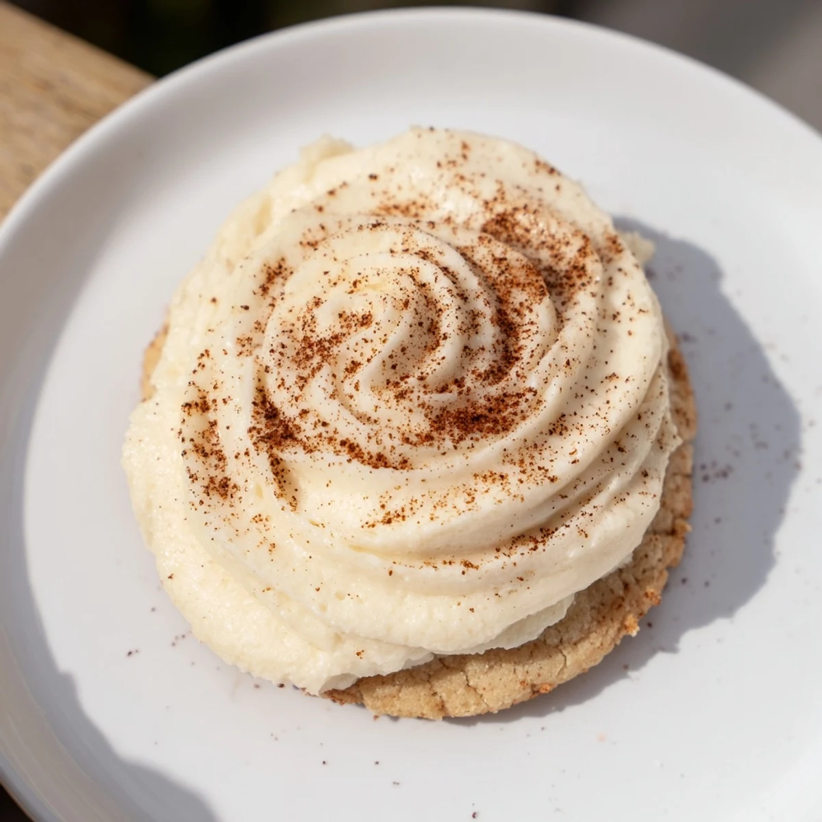 Frosted Delight Cinnamon Drift Keto Cookies, frosted and ready to eat, look delicious on a plate.