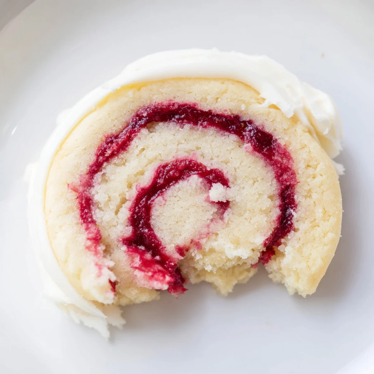 Frosted Delight Cranberry Swirl Sugar Cookies with creamy vanilla frosting on a rustic wood table.