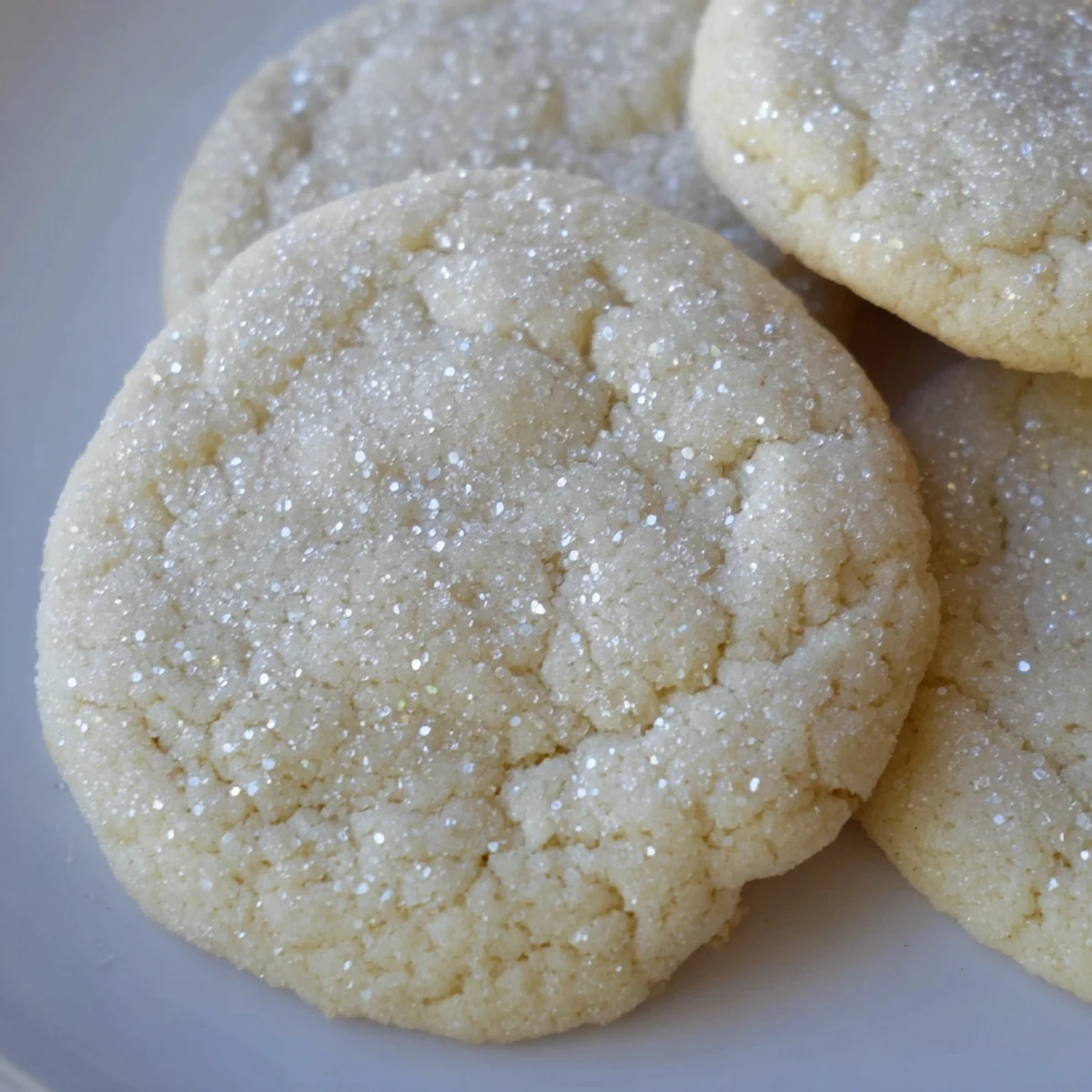 Freshly baked January Bliss Vanilla Cloud Sugar Cookies, soft and pale, just set at the edges on a cooling rack.