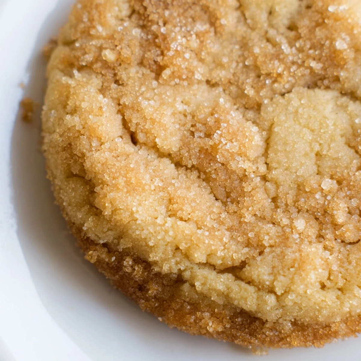 Freshly baked Fireplace Treat Maple Dream Sugar Cookies on a wire cooling rack with cracked edges.