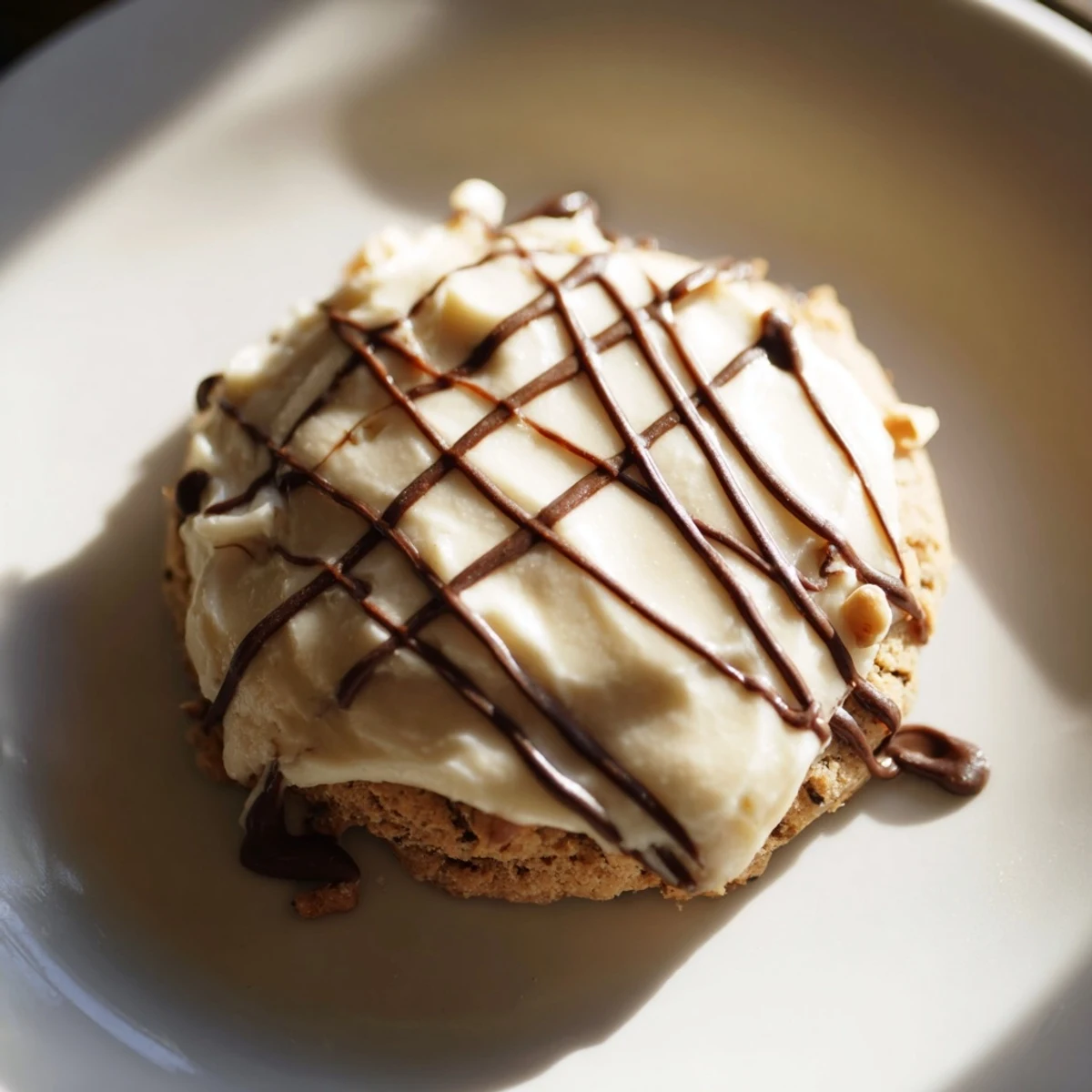 A close-up of Frosted Delight Hazelnut Drizzle Keto Cookies showcasing their soft, buttery texture and smooth sugar-free frosting.