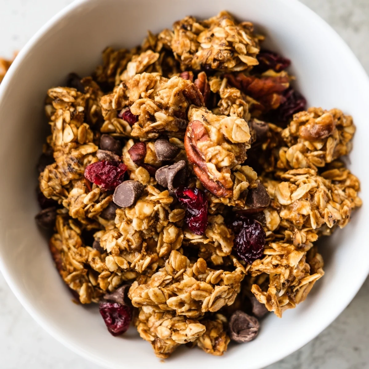 Golden clusters of Fireplace Treat Maple Dream bake to a crisp, fragrant perfection with toasted pecans and warm cinnamon on a parchment-lined sheet.  