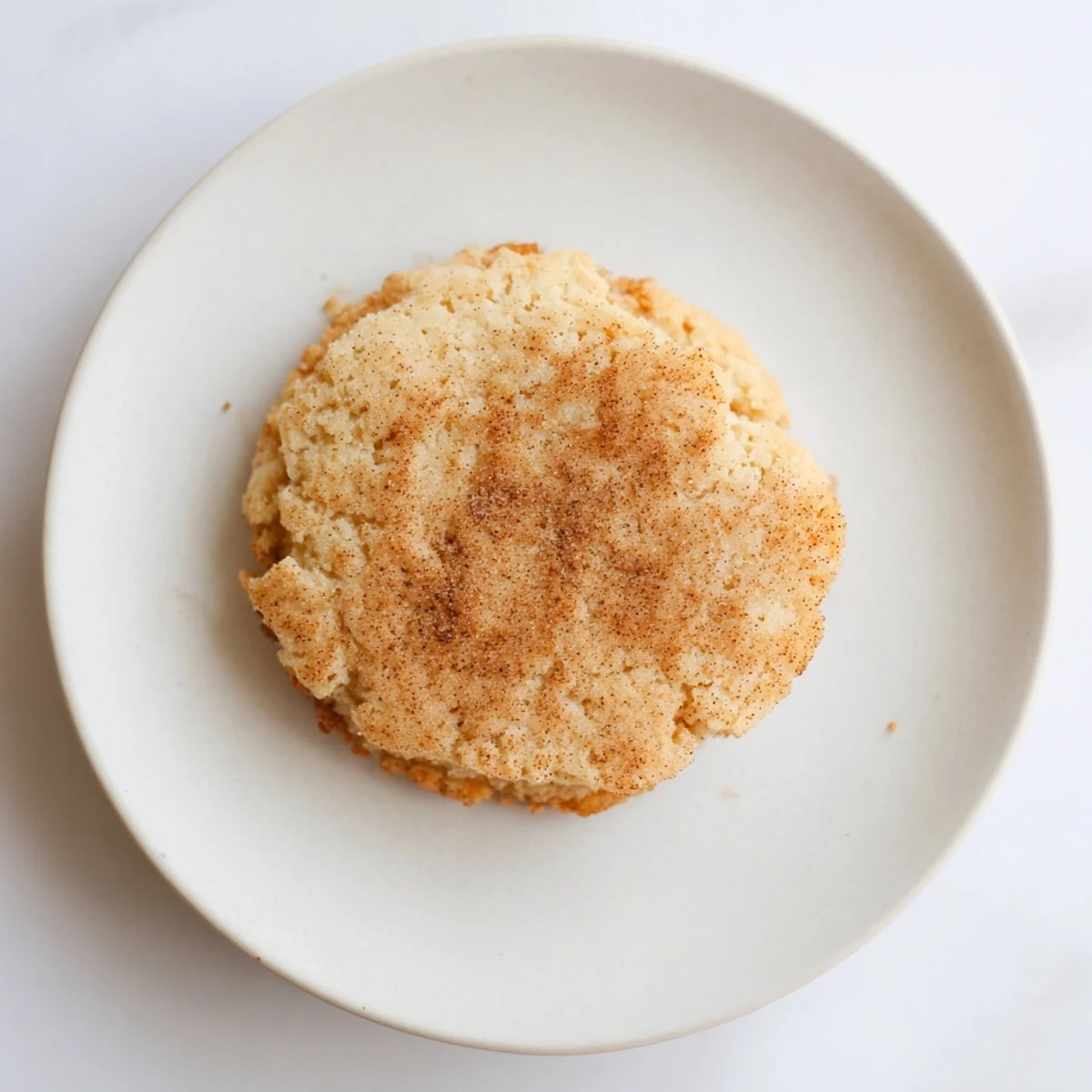 Freshly baked Winter Market Cinnamon Drift Keto Cookies cooling on a wire rack with golden edges.