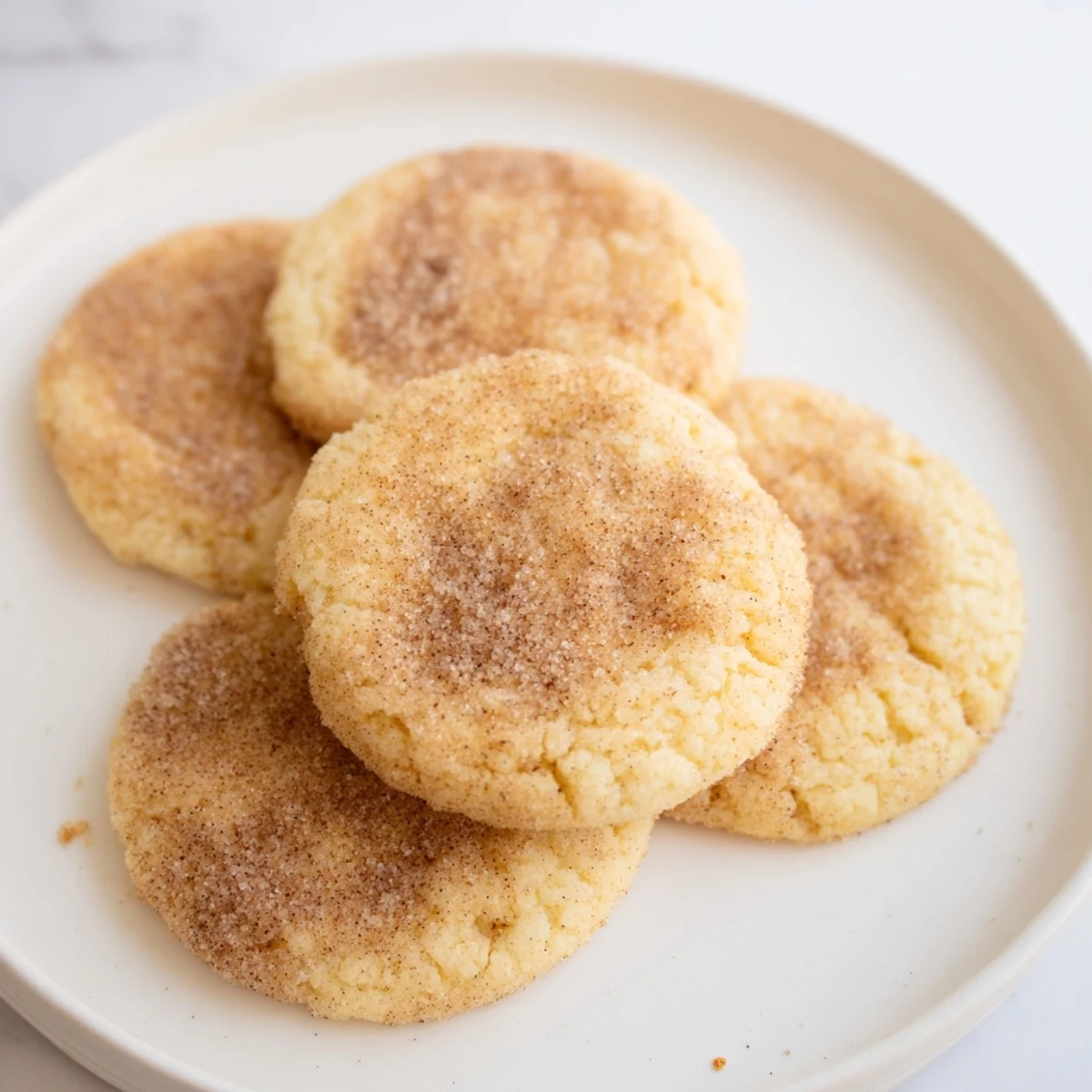 Freshly baked Churro Style Keto Sugar Cookies brushed with butter and ready to enjoy.