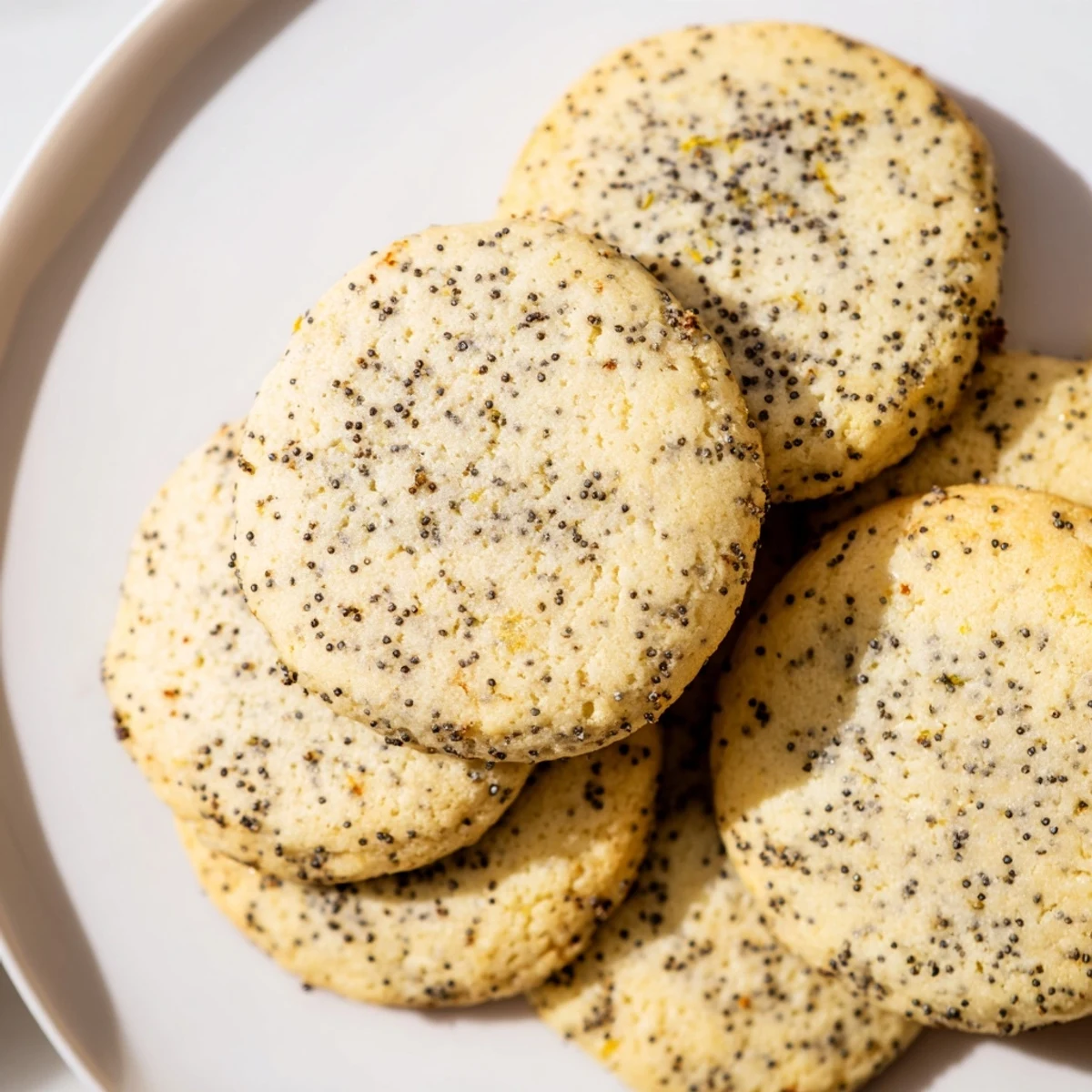 Lemon Poppy Seed Gluten-Free Sugar Cookies baked golden with a tender crumb on a parchment-lined tray.