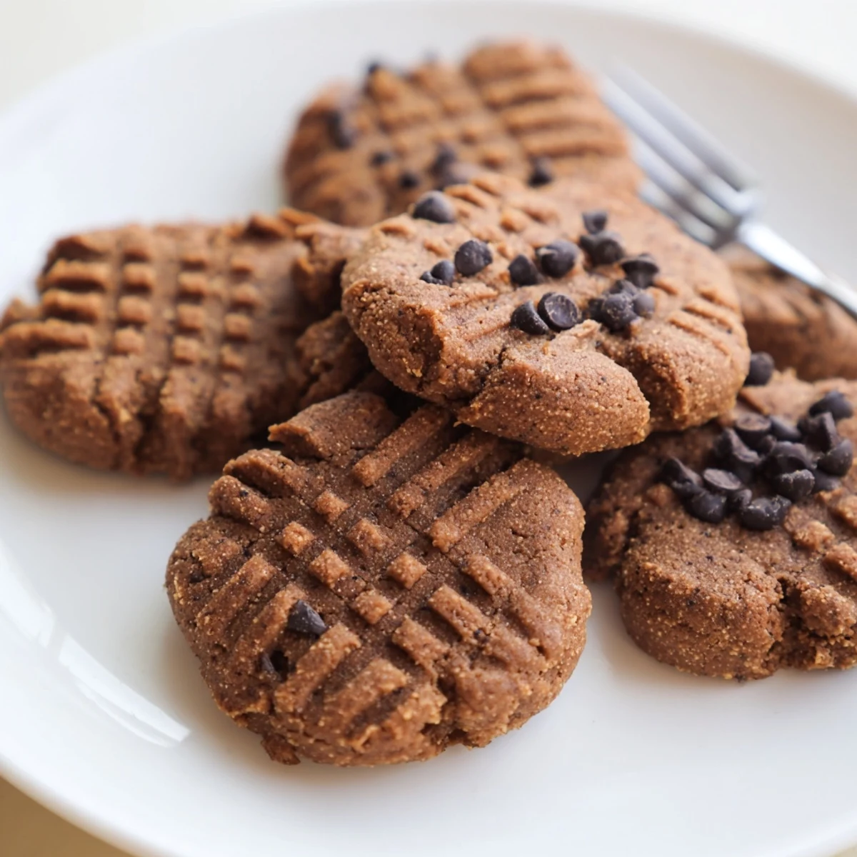 Stack of warm Keto Peanut Butter Espresso Cookies with a low-carb snack vibe, perfect for keto dessert or morning coffee pairing.