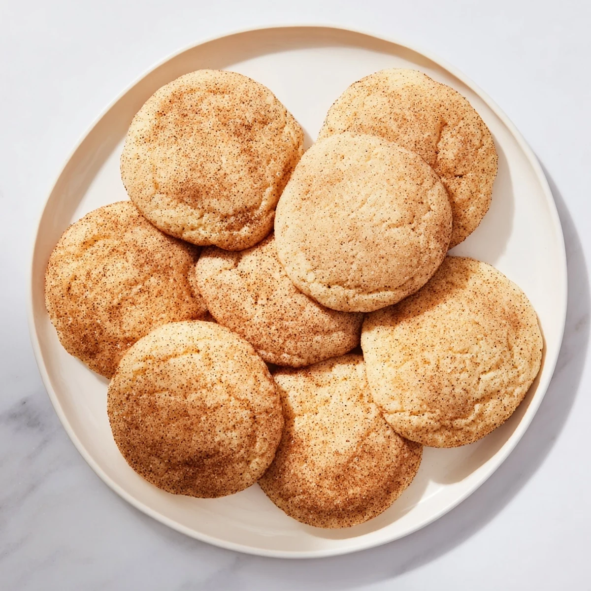 Gluten-Free Churro Sugar Cookies cooling on a wire rack, golden edges and sugary crust glistening in warm, soft light.