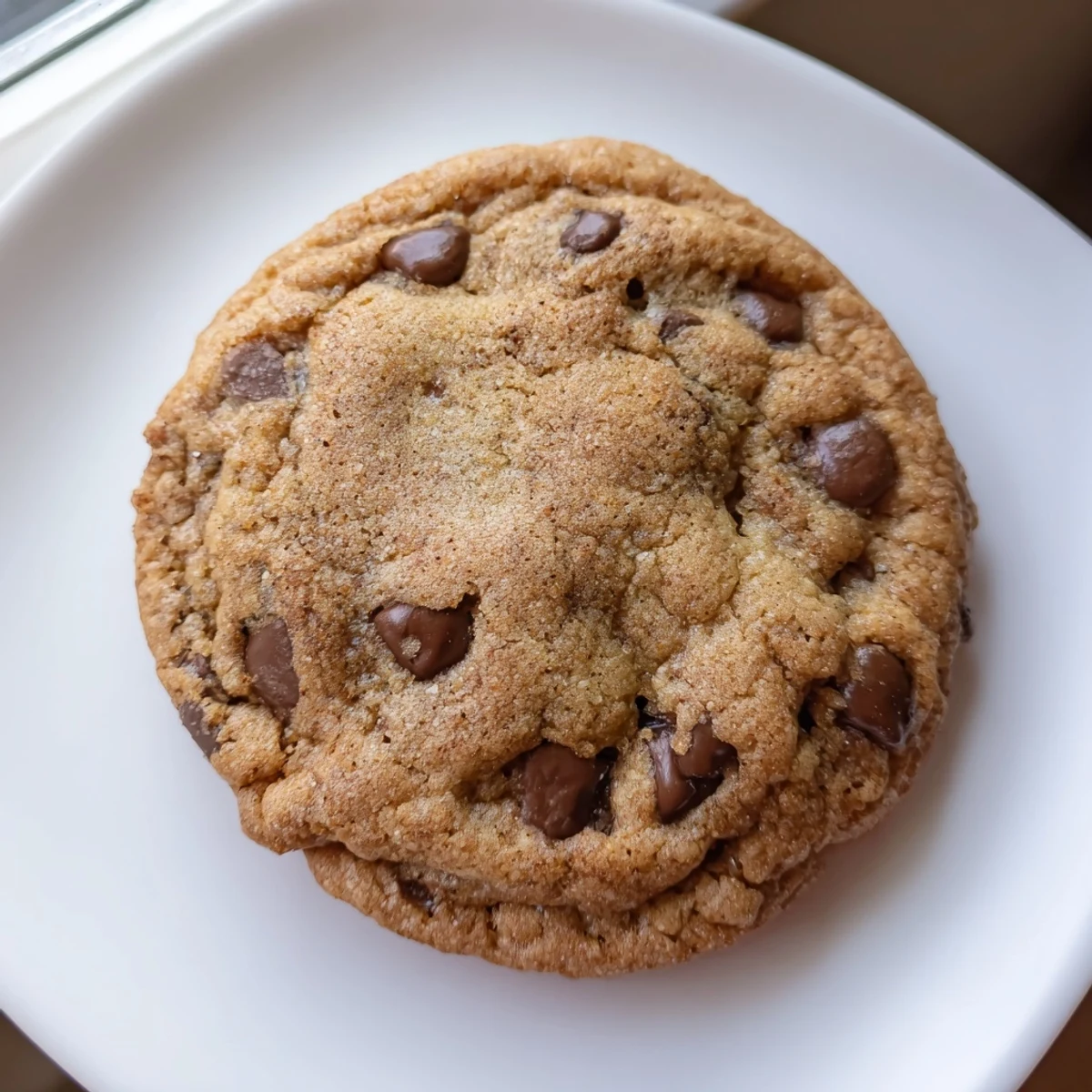 Golden brown butter cinnamon chocolate chip cookies with gooey melted chocolate centers