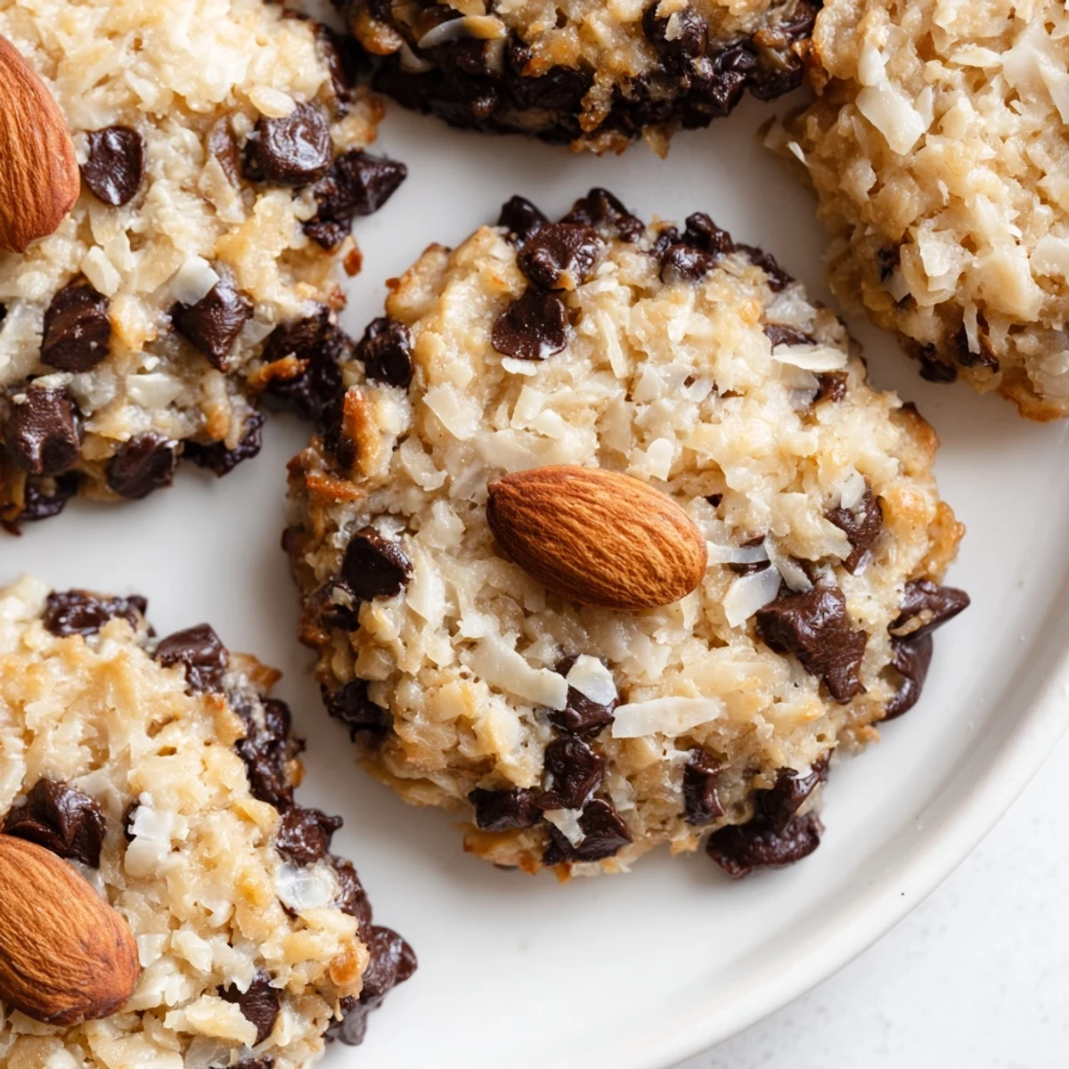 Homemade low-carb cookies featuring coconut, almonds, and melted sugar-free chocolate chips