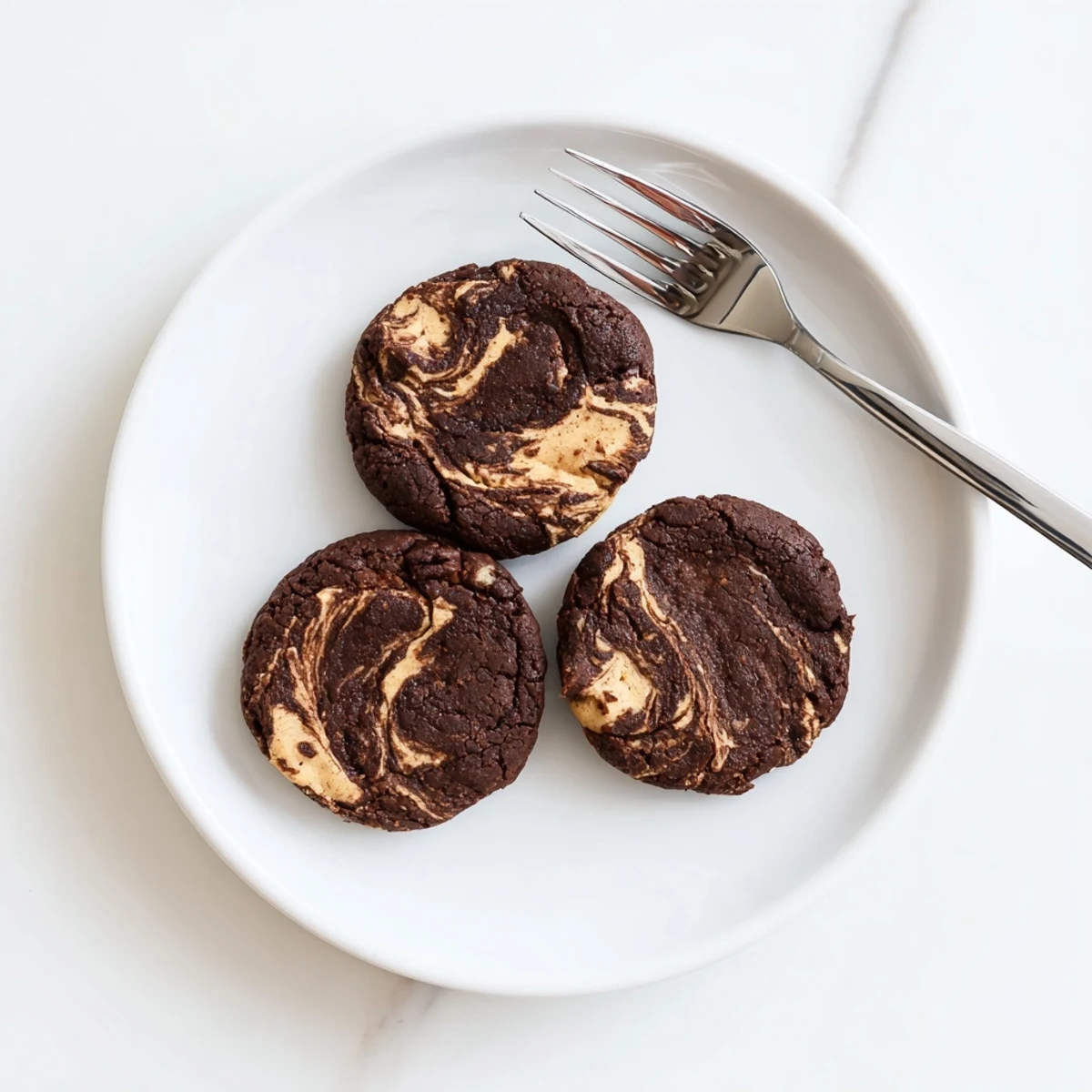 Golden-brown keto chocolate almond butter swirl cookies cooling on wire rack ready for serving