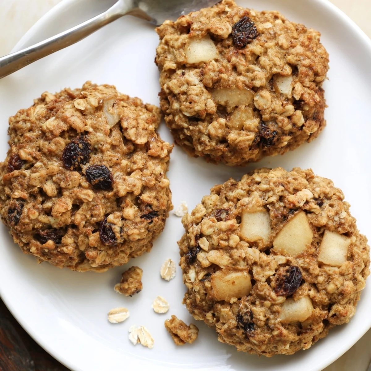 Soft Apple Nutmeg Oatmeal Raisin Cookies speckled with diced apple, plump raisins
