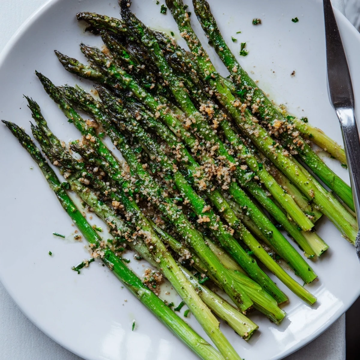 Bright green Roasted Asparagus With Garlic Herb Crunch, aromatic garlic and fresh parsley