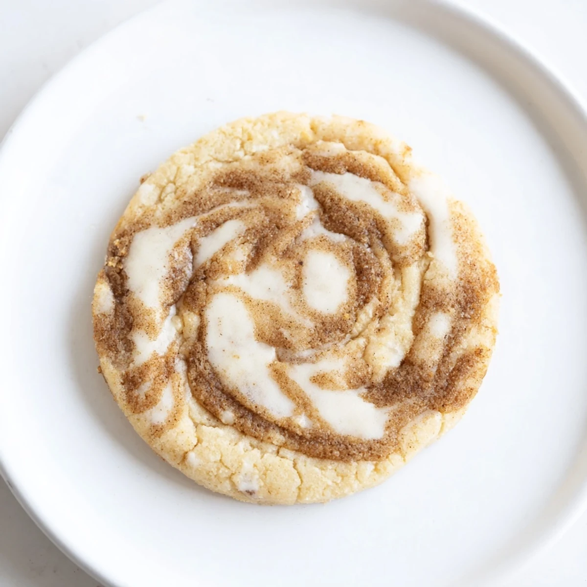 Keto Vanilla Almond Butter Swirl Cookies cooling on parchment, marbled golden tops