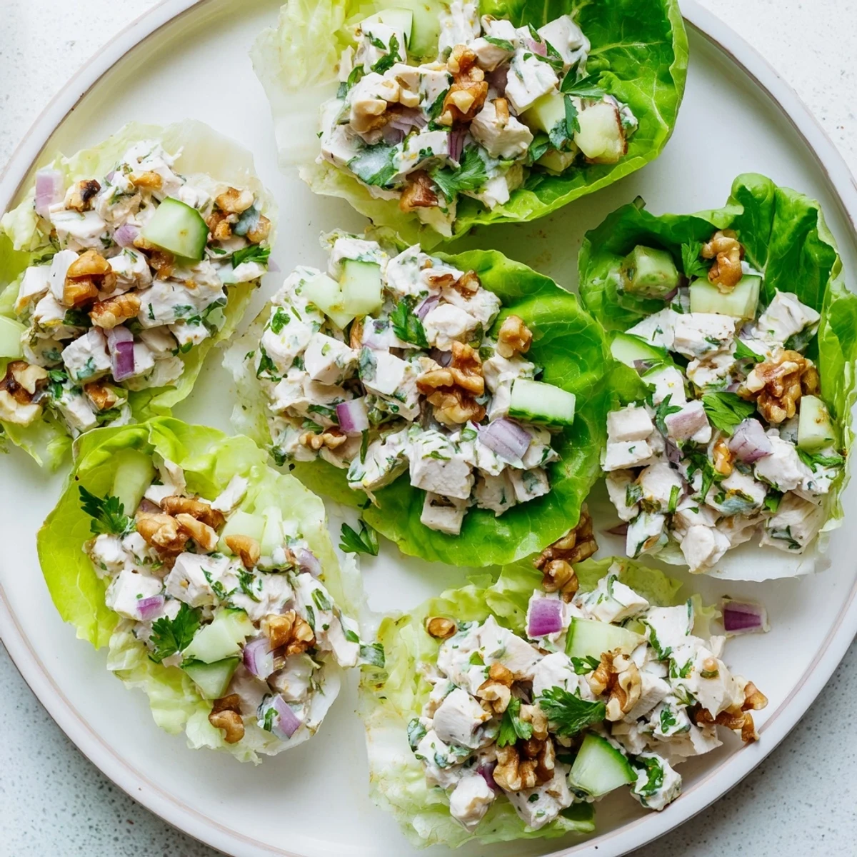 Creamy cottage cheese lemon thyme chicken salad served in crisp green butter lettuce cups
