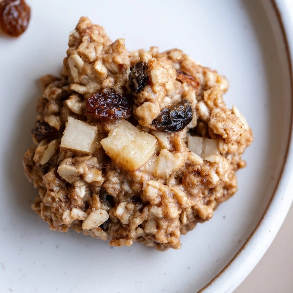 Hearty Apple Maple Oatmeal Raisin Cookies studded with diced apple and raisins