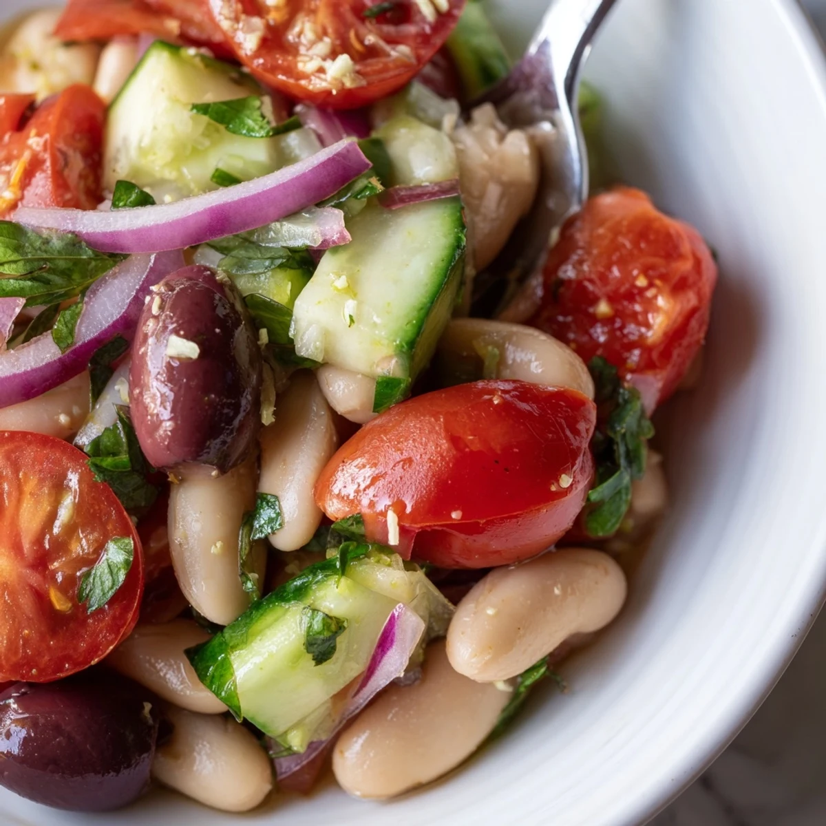Chilled, herb-scented Mediterranean White Bean and Tomato Basil Cucumber Salad, perfect picnic fare