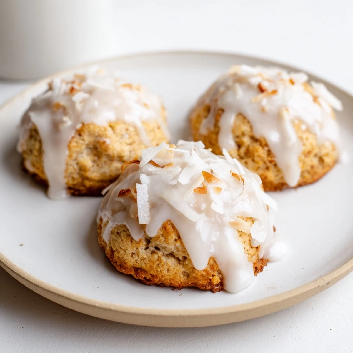 Plate of low-carb maple coconut cookies with melted butter drizzle ready for serving