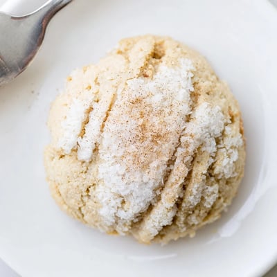 Soft Keto Cinnamon Coconut Butter Cookies cooling on wire rack, coconut flecks visible